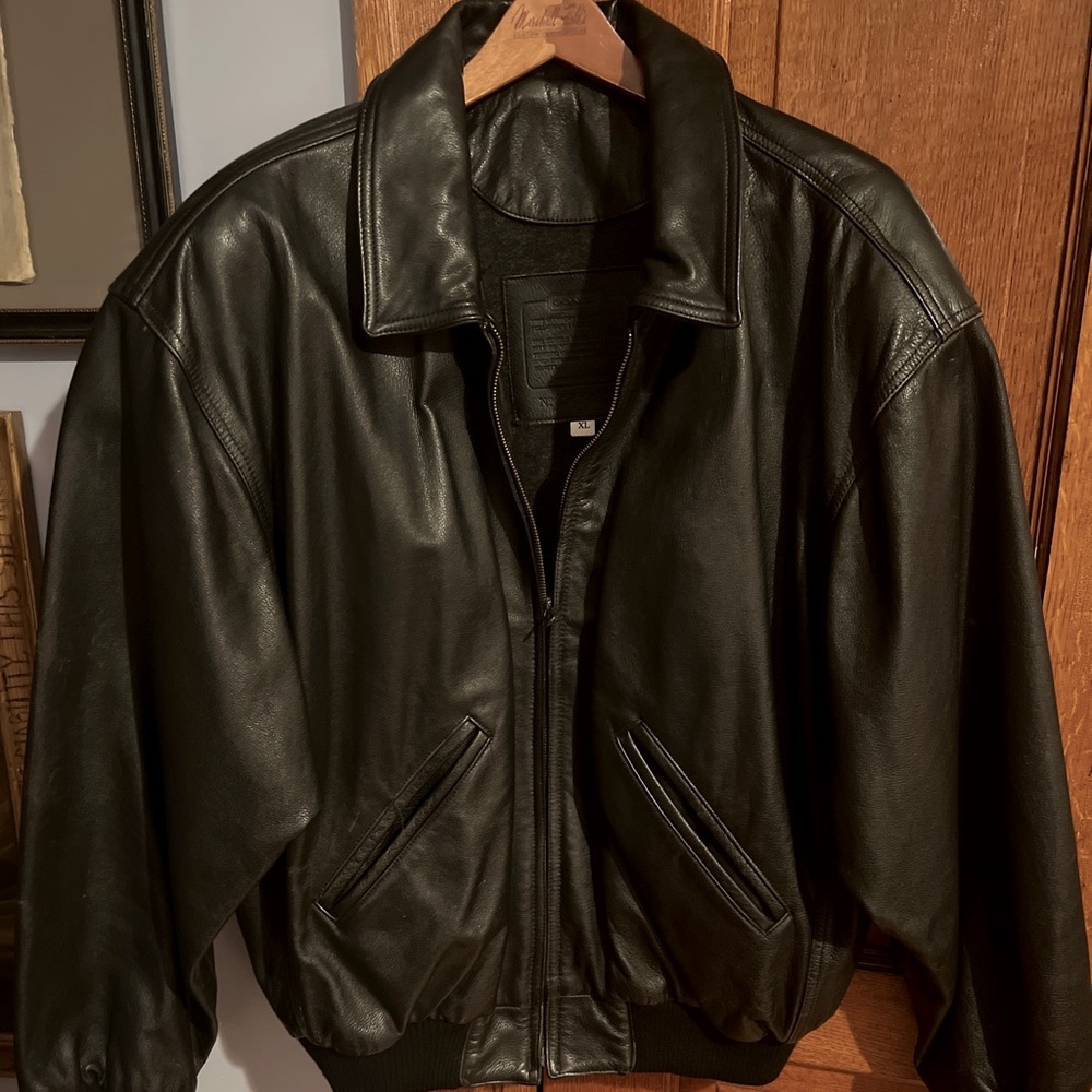 Never worn coach black leather bomber jacket in pristine condition size XL
